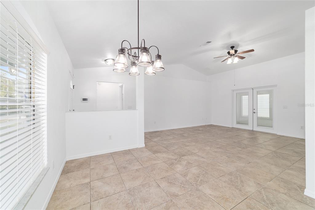 13688 Southwest 113th Lane Dunnellon, FL 34432 - Photo 19 of 70 a view of a chandelier fan and entryway