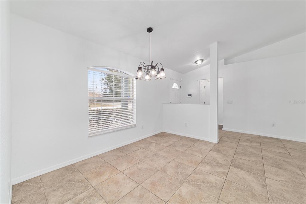 13688 Southwest 113th Lane Dunnellon, FL 34432 - Photo 20 of 70 a view of an empty room with chandelier