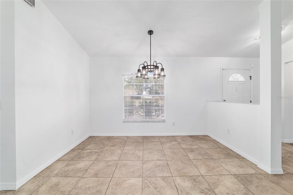 13688 Southwest 113th Lane Dunnellon, FL 34432 - Photo 21 of 70 a view of an empty room with a window