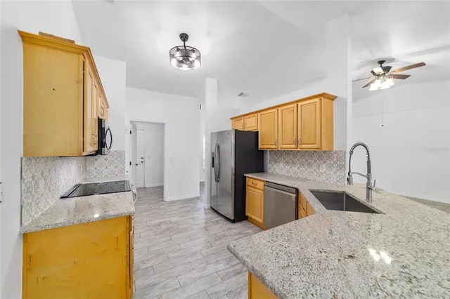 a bathroom with a bathtub a shower a mirror and a sink