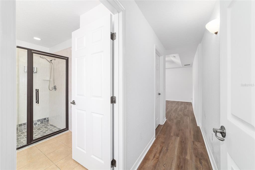 13688 Southwest 113th Lane Dunnellon, FL 34432 - Photo 35 of 70 a view of a hallway with wooden floor and a bathroom