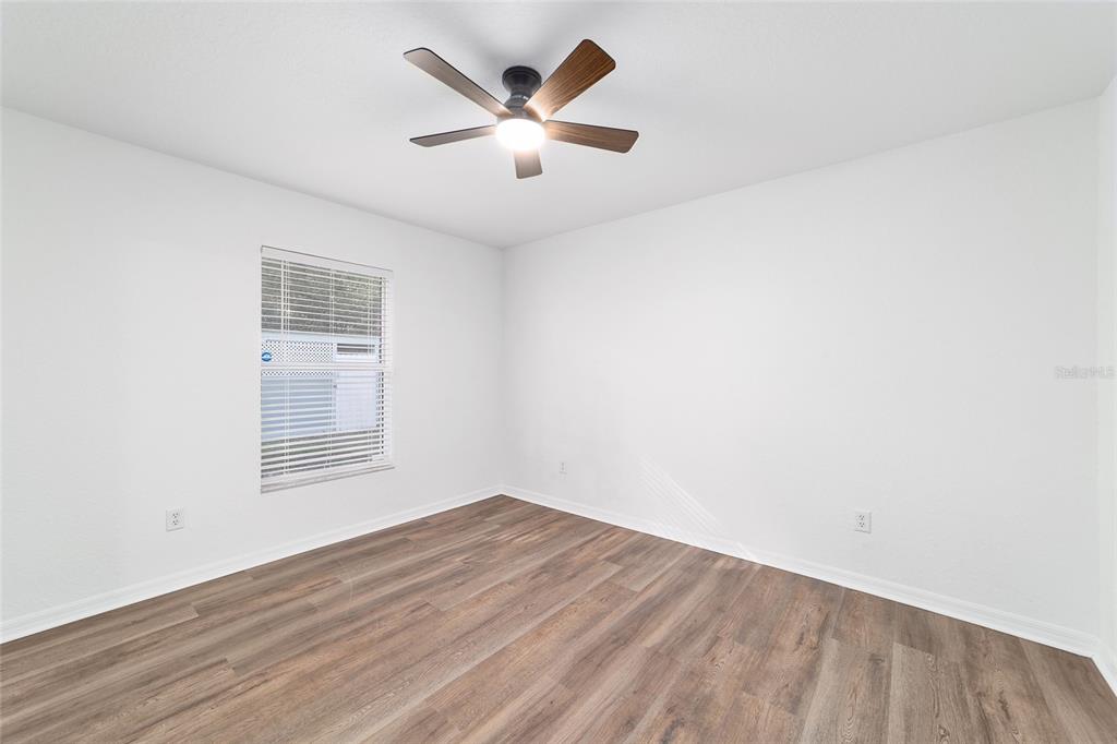 13688 Southwest 113th Lane Dunnellon, FL 34432 - Photo 46 of 70 an empty room with a window and a ceiling fan