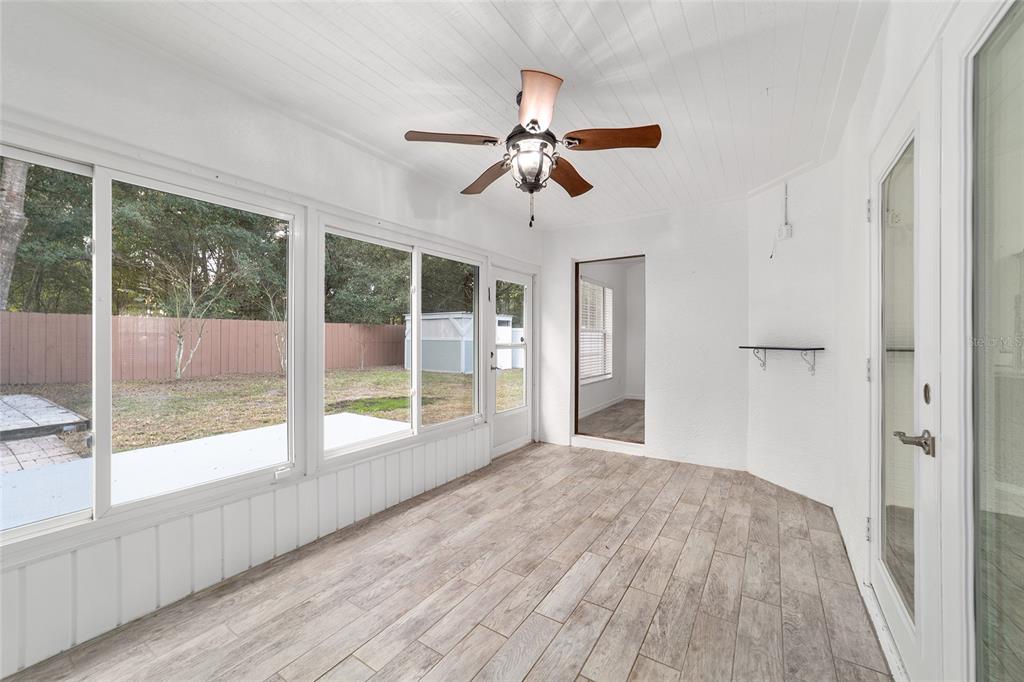 13688 Southwest 113th Lane Dunnellon, FL 34432 - Photo 56 of 70 a view of empty room with wooden floor and fan
