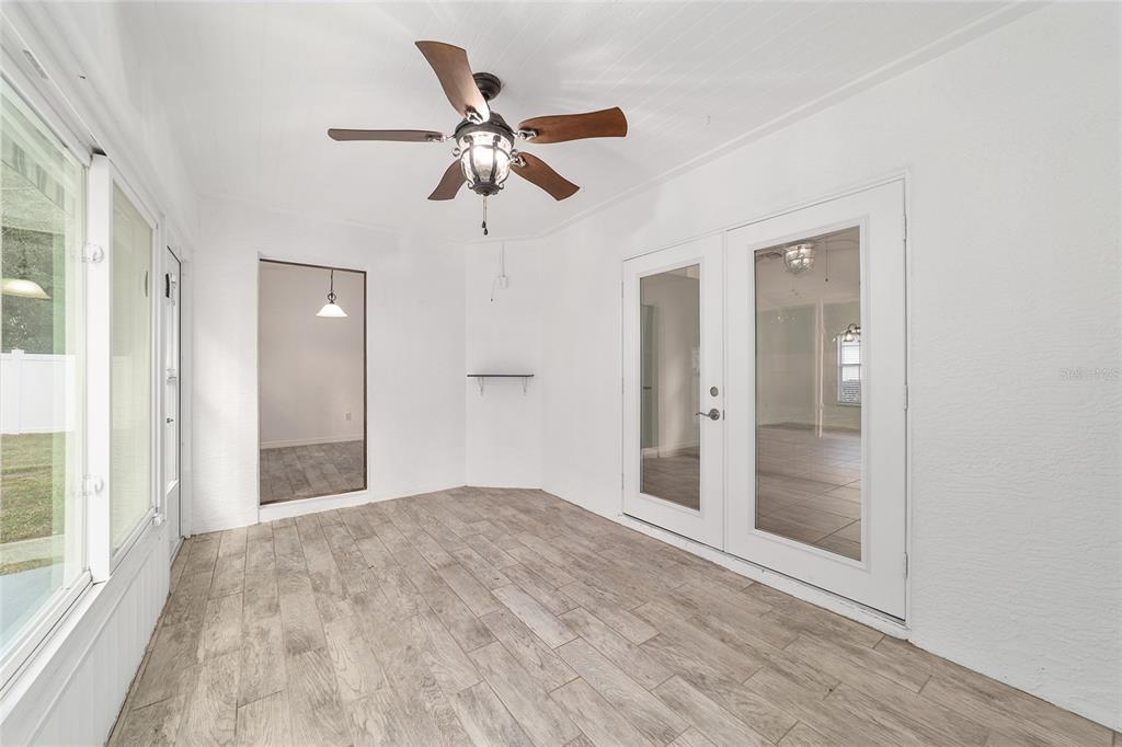 13688 Southwest 113th Lane Dunnellon, FL 34432 - Photo 57 of 70 wooden floor in an empty room with a window