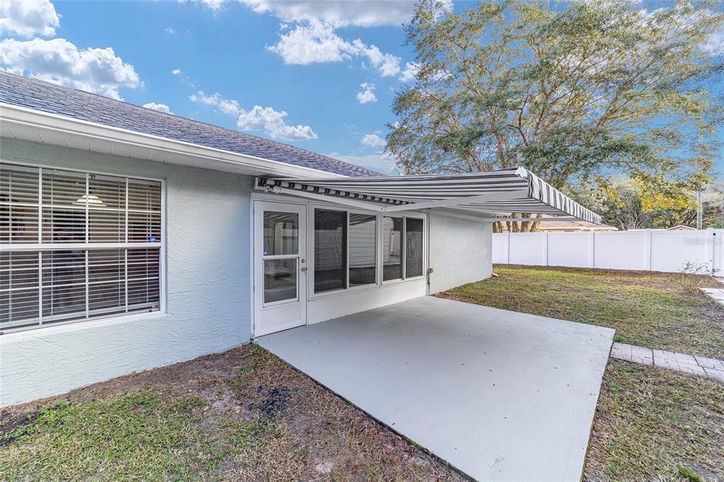 13688 Southwest 113th Lane Dunnellon, FL 34432 - Photo 69 of 70 a view of a house with a yard and potted plants