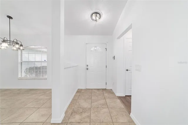 a view of an empty room with a fan