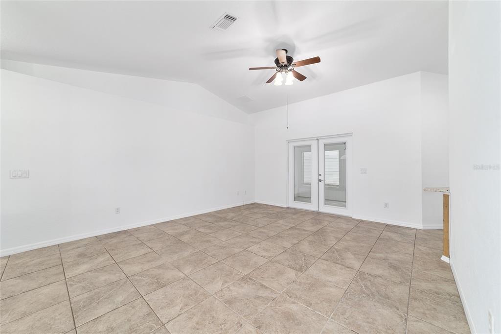 13688 Southwest 113th Lane Dunnellon, FL 34432 - Photo 10 of 70 a view of an empty room with a fan