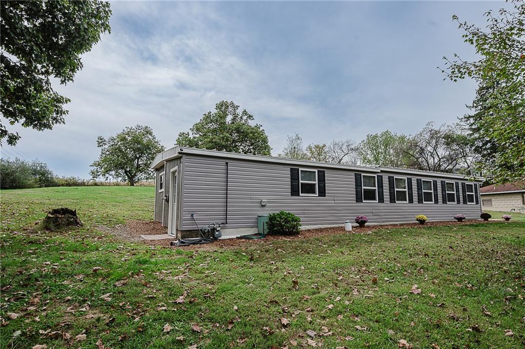 a view of a house with backyard