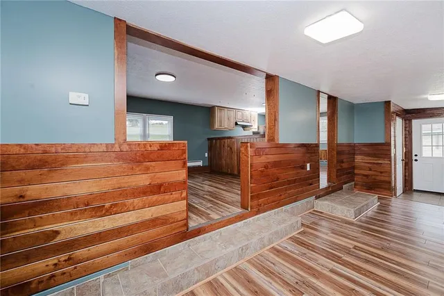 a view of room with wooden floor