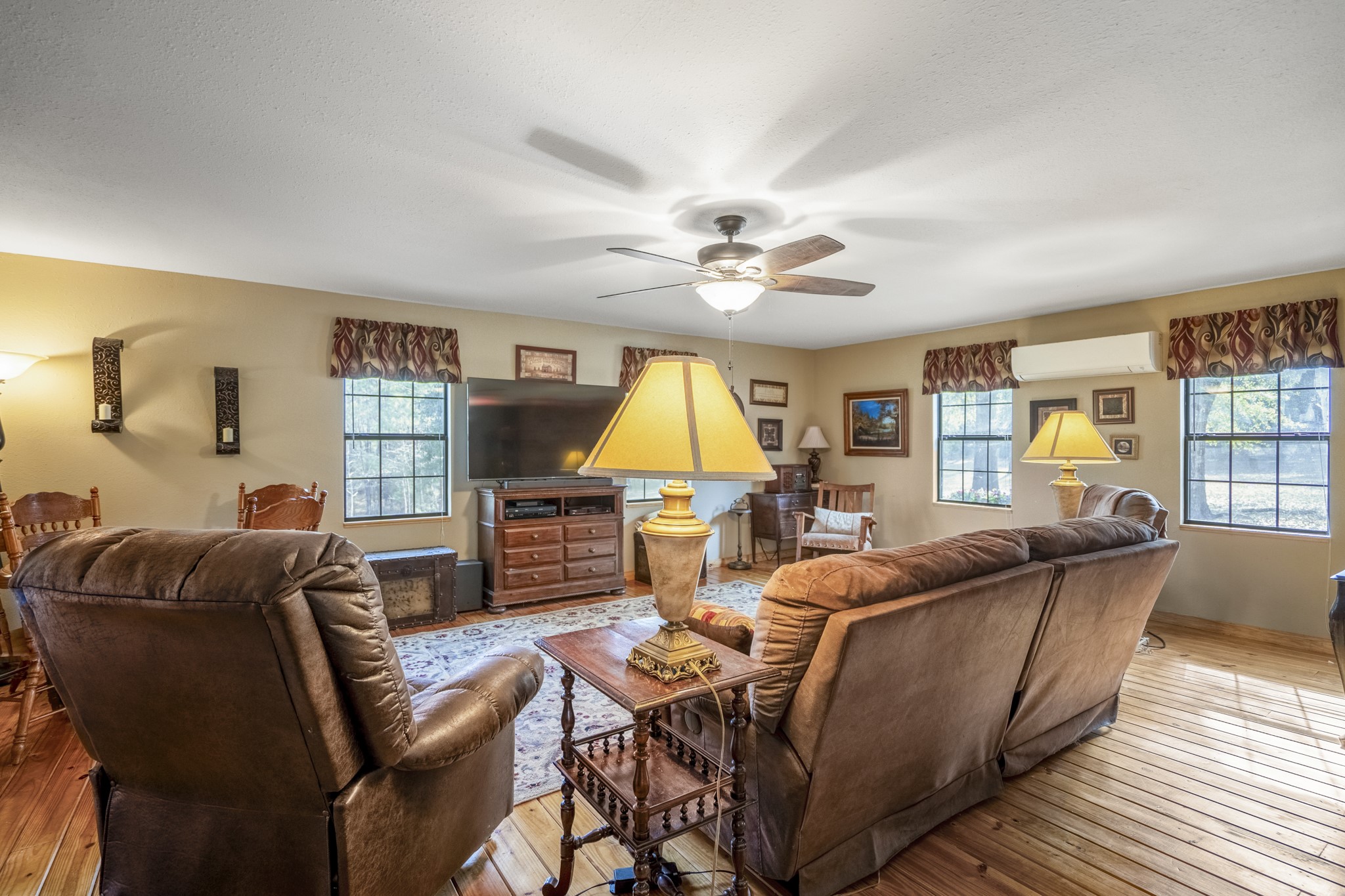 5415 Old Israel Road Livingston, TX 77351 - Photo 4 of 45 The spacious living room is surrounded by tree-lined views.