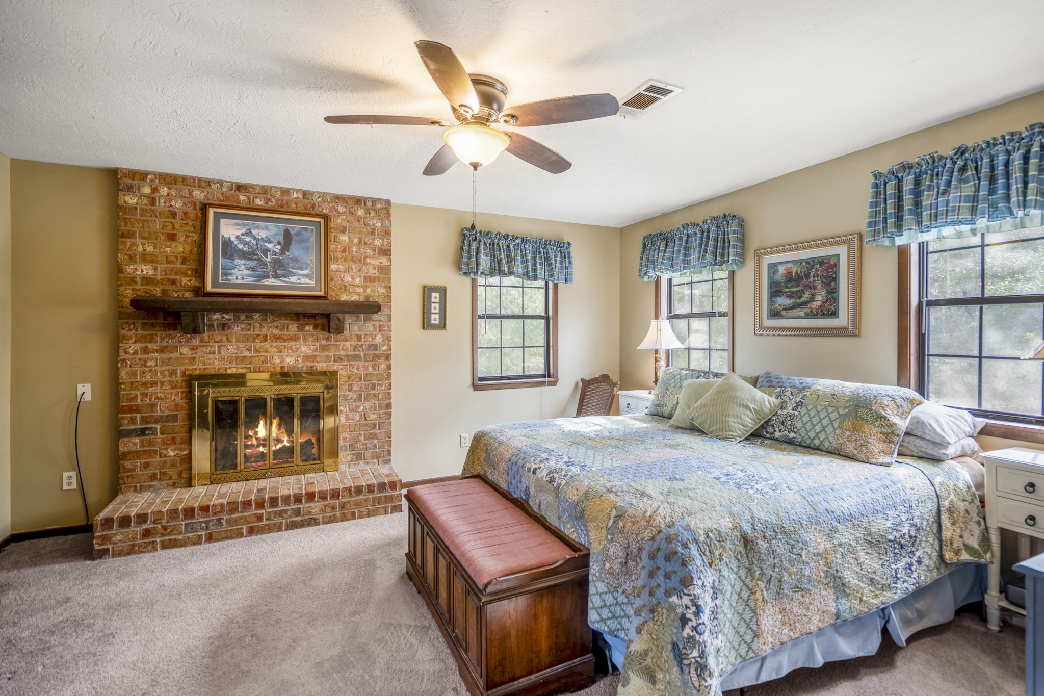 5415 Old Israel Road Livingston, TX 77351 - Photo 6 of 45 Expansive Primary Bedroom with an en suite bath and its very own fireplace.