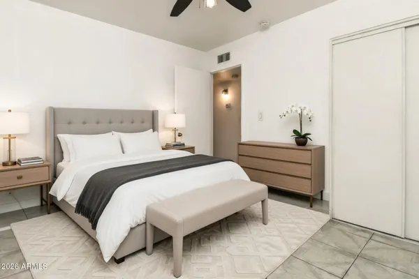 a kitchen with kitchen island granite countertop a sink white cabinets stainless steel appliances and cabinets