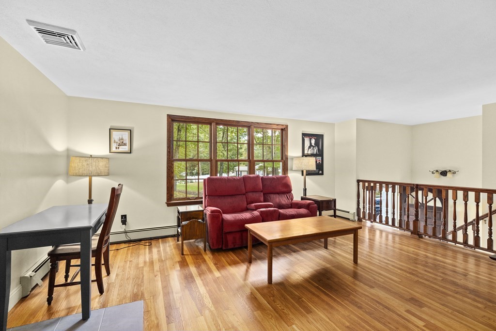 30 Eaton Road Framingham, MA 01701 - Photo 17 of 36 a living room with furniture and a wooden floor