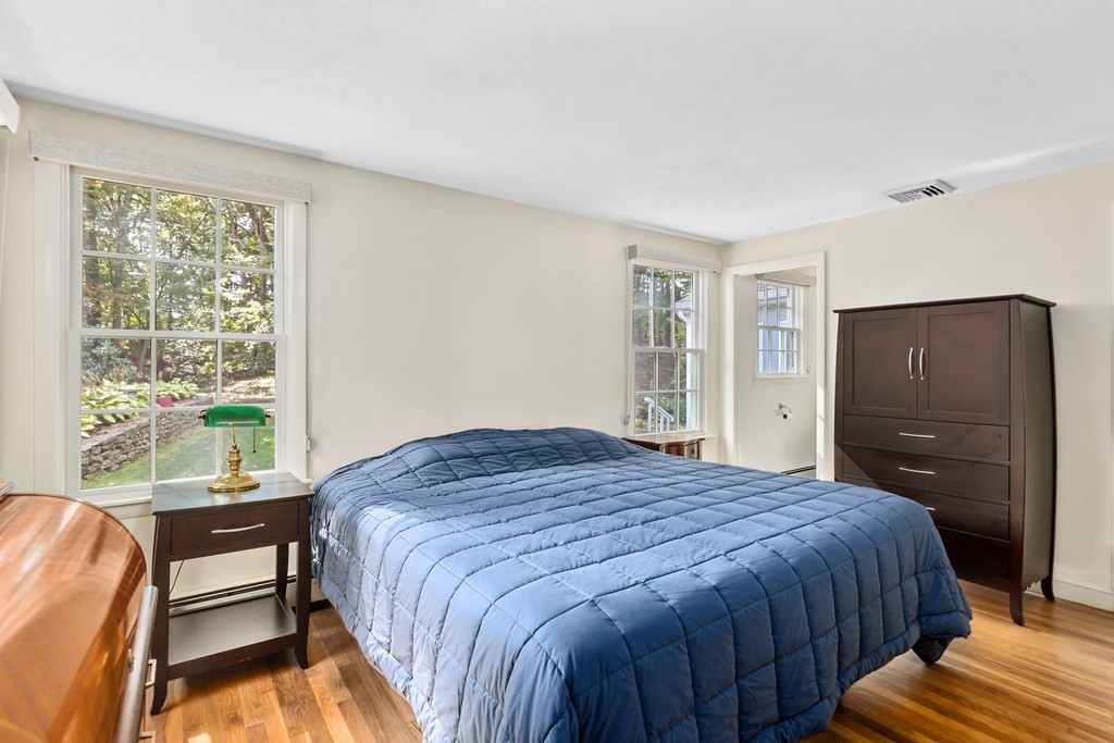 30 Eaton Road Framingham, MA 01701 - Photo 20 of 36 a bedroom with a bed closet and a large window