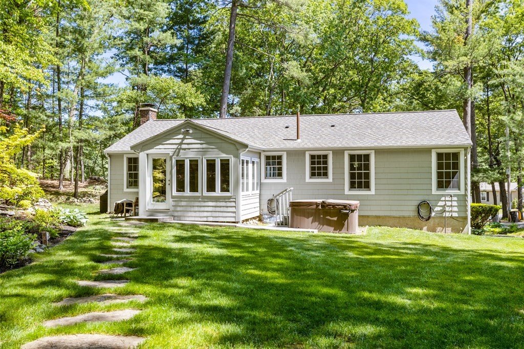 30 Eaton Road Framingham, MA 01701 - Photo 5 of 36 a front view of a house with a yard table and chairs