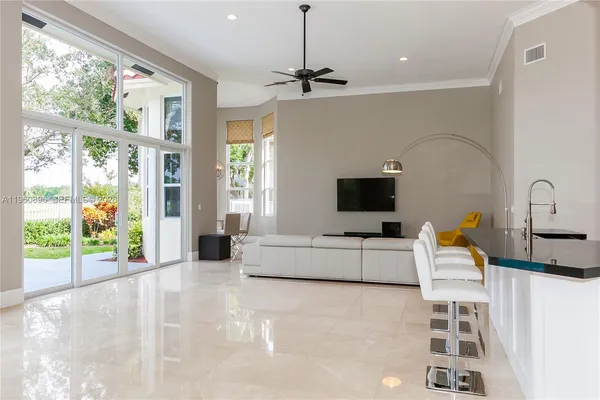 a view of a dining room with furniture window and outside view