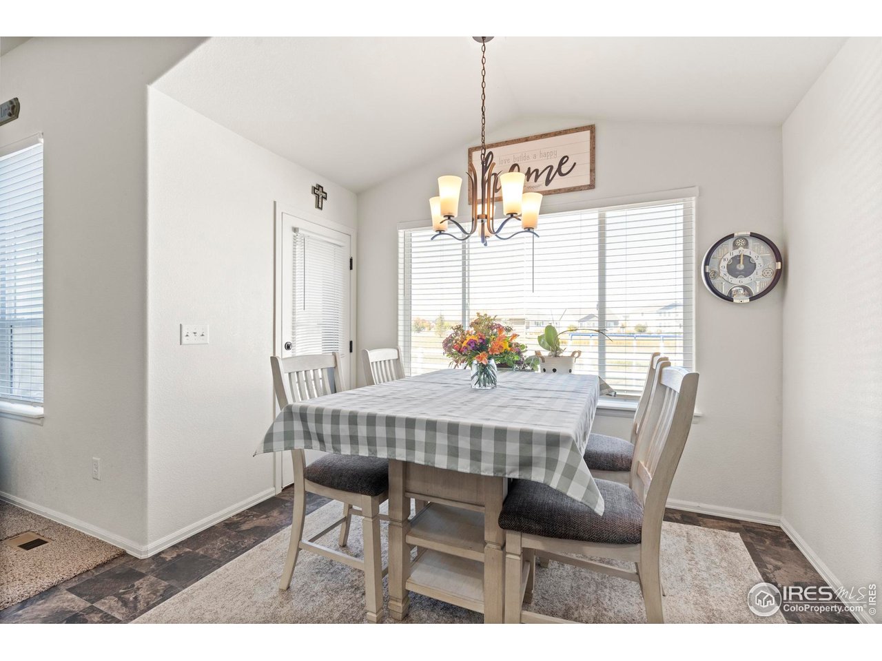 941 Barasingha Street Severance, CO 80550 - Photo 17 of 46 a table and chairs in a room