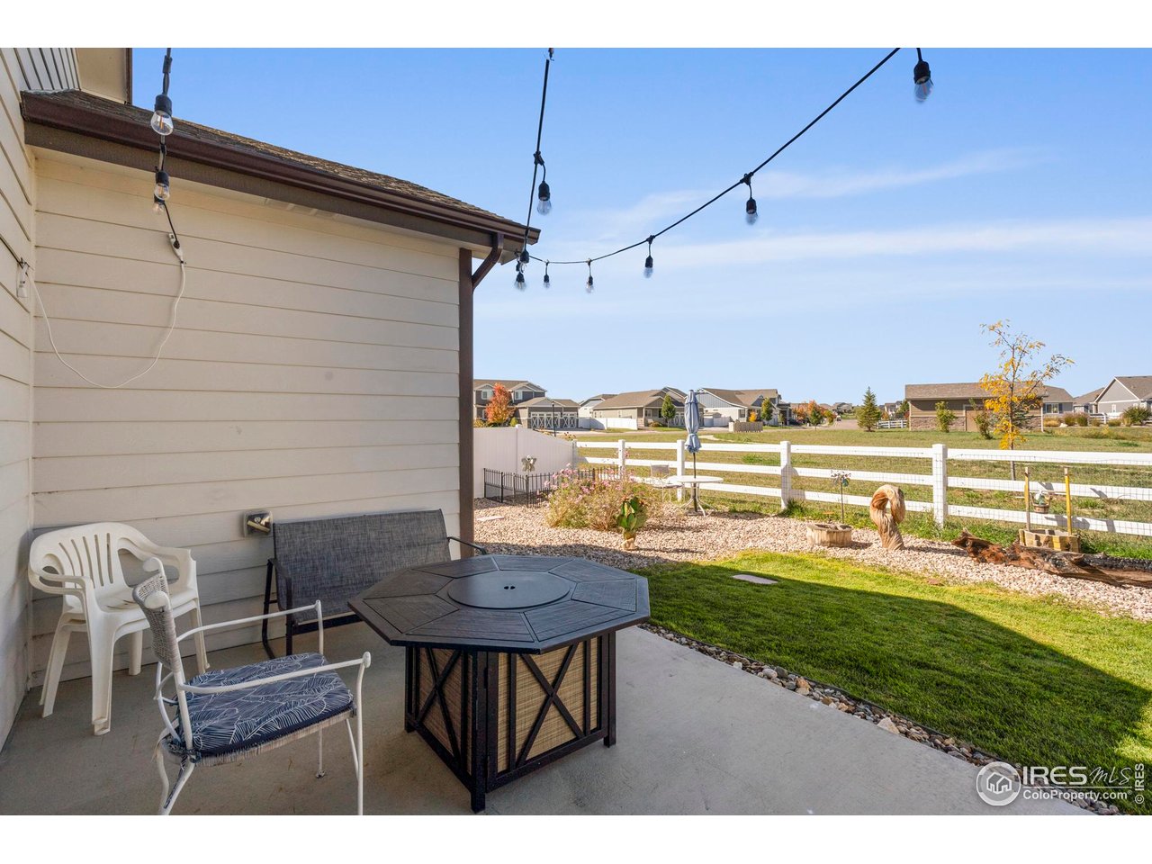 941 Barasingha Street Severance, CO 80550 - Photo 31 of 46 a view of a patio with table and chairs and potted plants