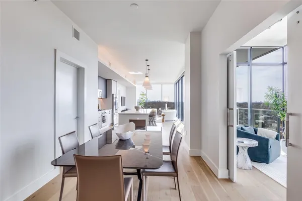 a view of a dining room with furniture window and wooden floor