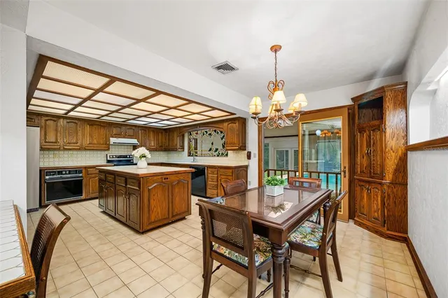 a kitchen with stainless steel appliances granite countertop a stove and a refrigerator