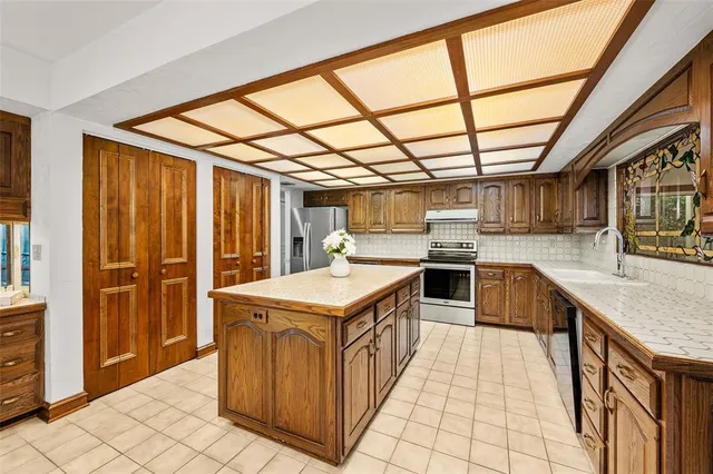 a kitchen with a sink and cabinets