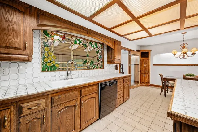 a living room with furniture and large windows