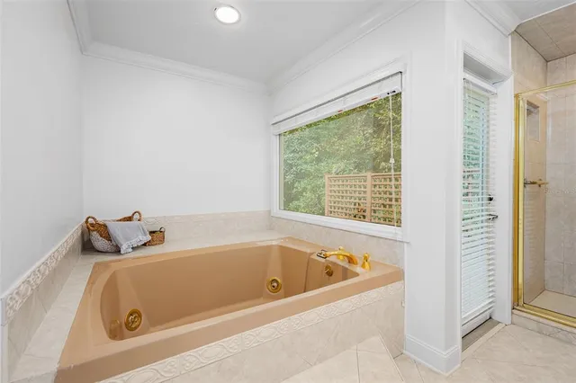 a view of a room with gym equipment and a window