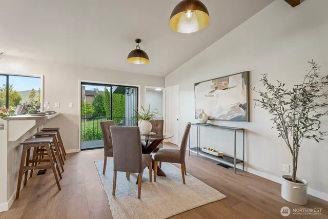 a view of a dining room with furniture window and wooden floor