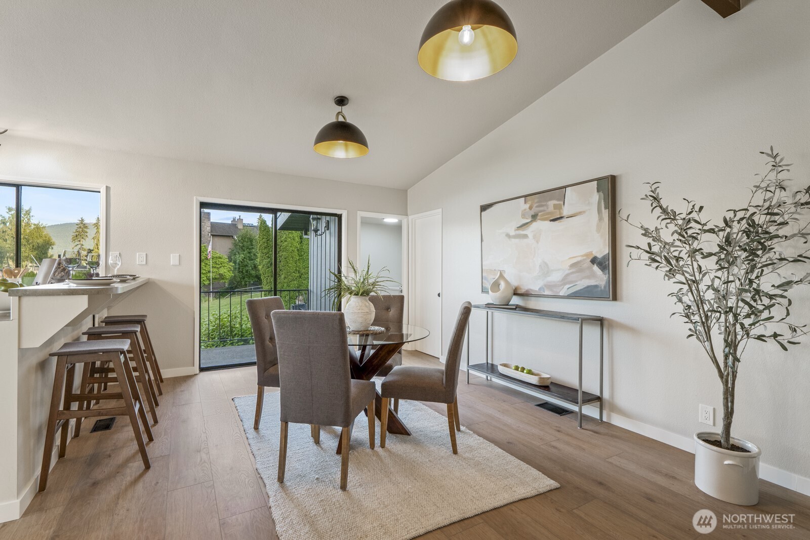 5110 Northwest Sammamish Road Issaquah, WA 98027 - Photo 17 of 40 a view of a dining room with furniture window and wooden floor