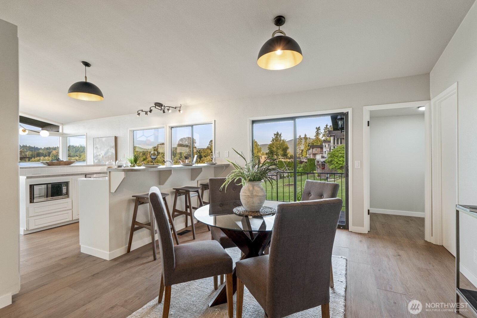 5110 Northwest Sammamish Road Issaquah, WA 98027 - Photo 18 of 40 a view of a dining room with furniture window and wooden floor
