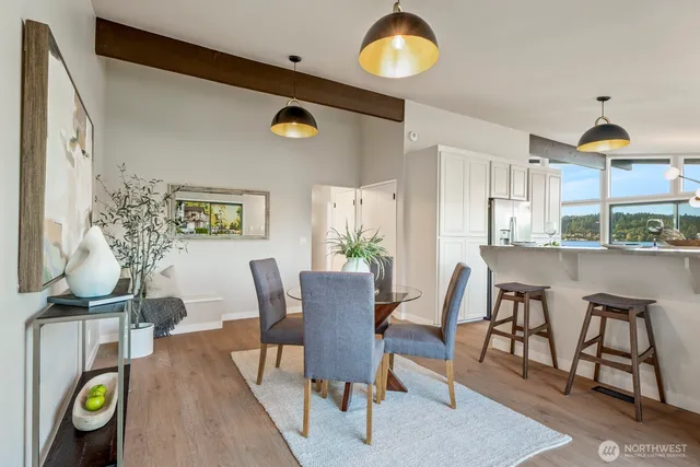 a dining room with furniture and window
