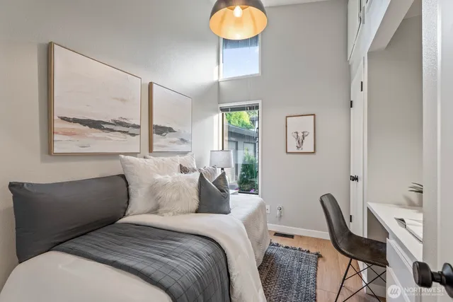 a bedroom with furniture and a window