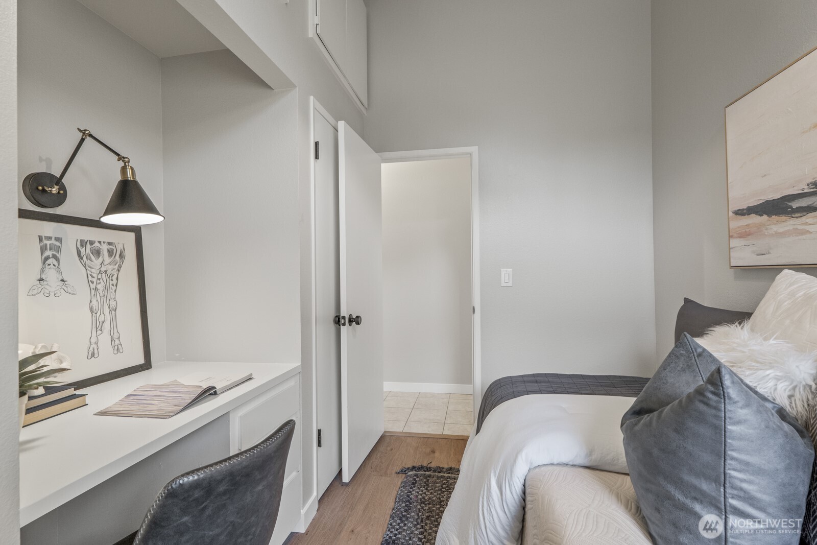 5110 Northwest Sammamish Road Issaquah, WA 98027 - Photo 22 of 40 a bedroom with a bed and a cabinets