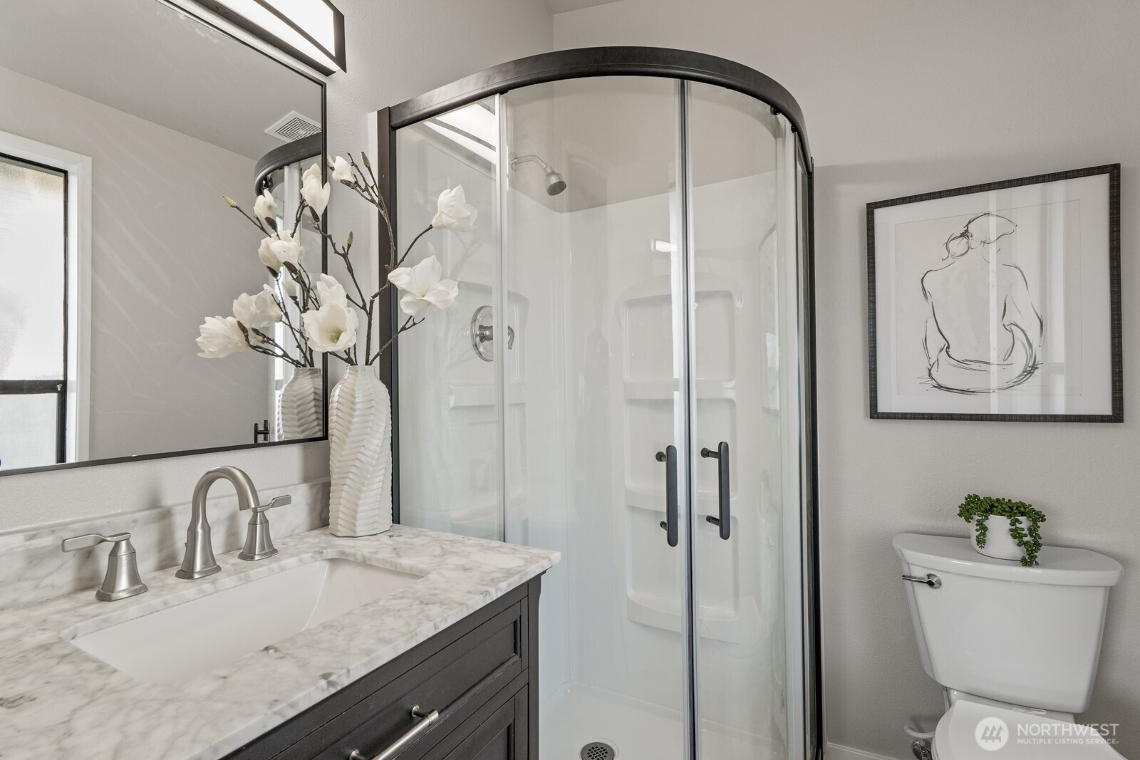5110 Northwest Sammamish Road Issaquah, WA 98027 - Photo 27 of 40 a bathroom with a granite countertop sink a toilet and shower