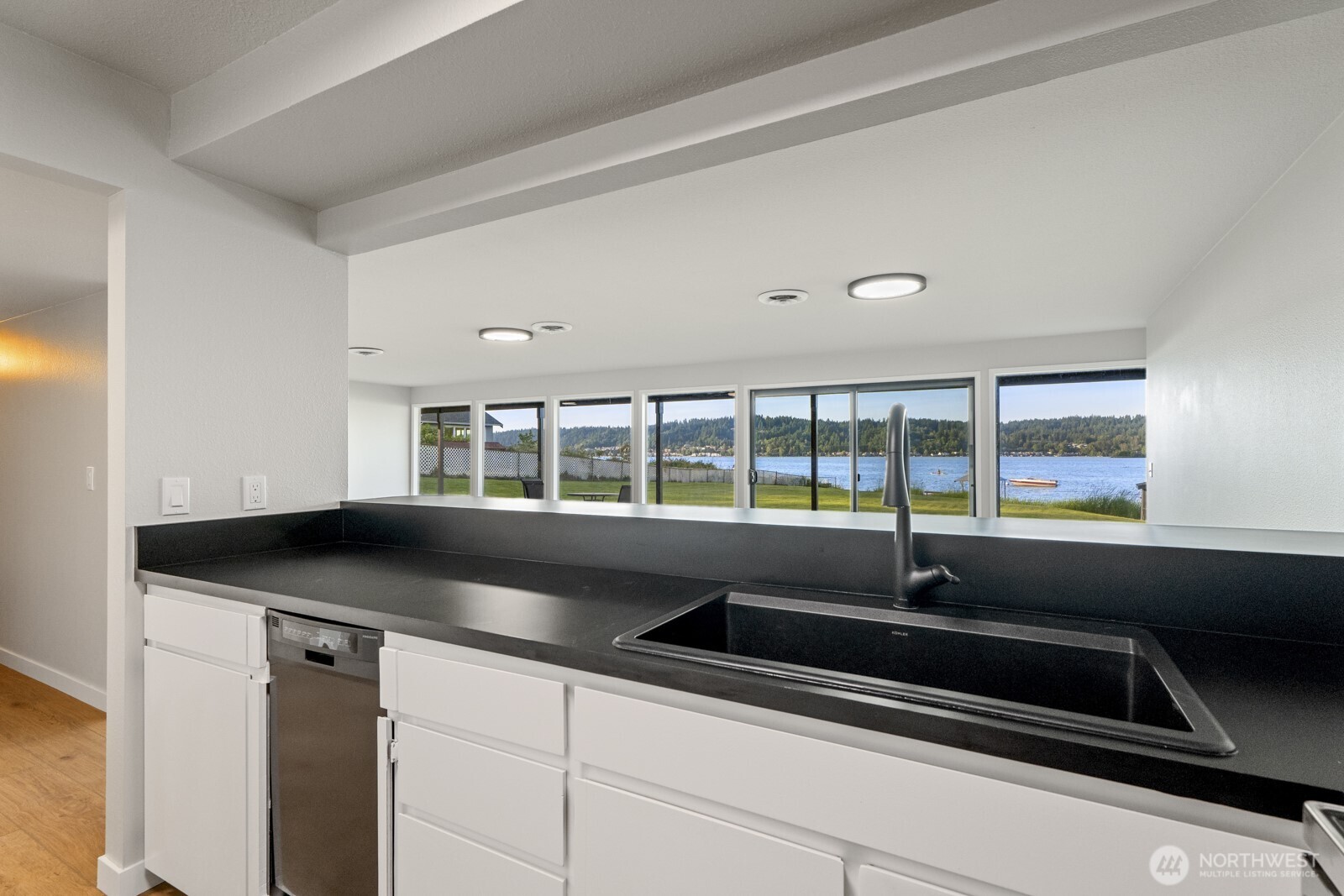 5110 Northwest Sammamish Road Issaquah, WA 98027 - Photo 32 of 40 a kitchen with granite countertop a sink and a stove