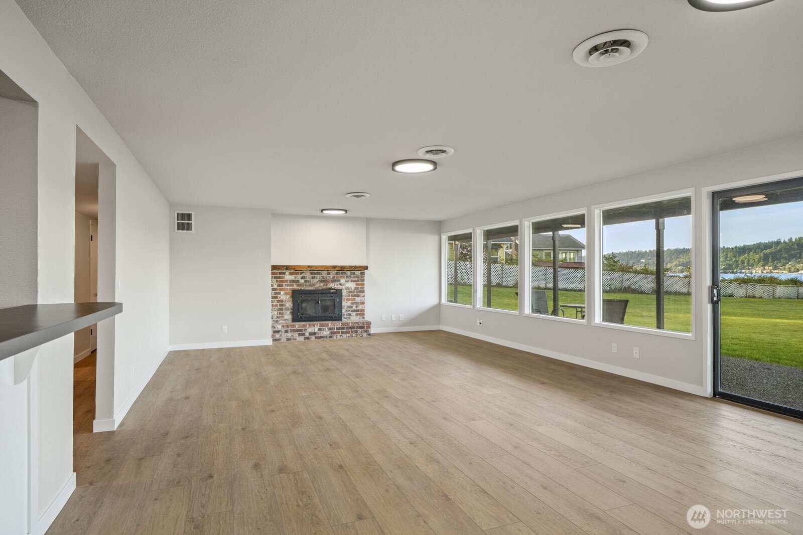 5110 Northwest Sammamish Road Issaquah, WA 98027 - Photo 34 of 40 a view of an empty room with a window and wooden floor