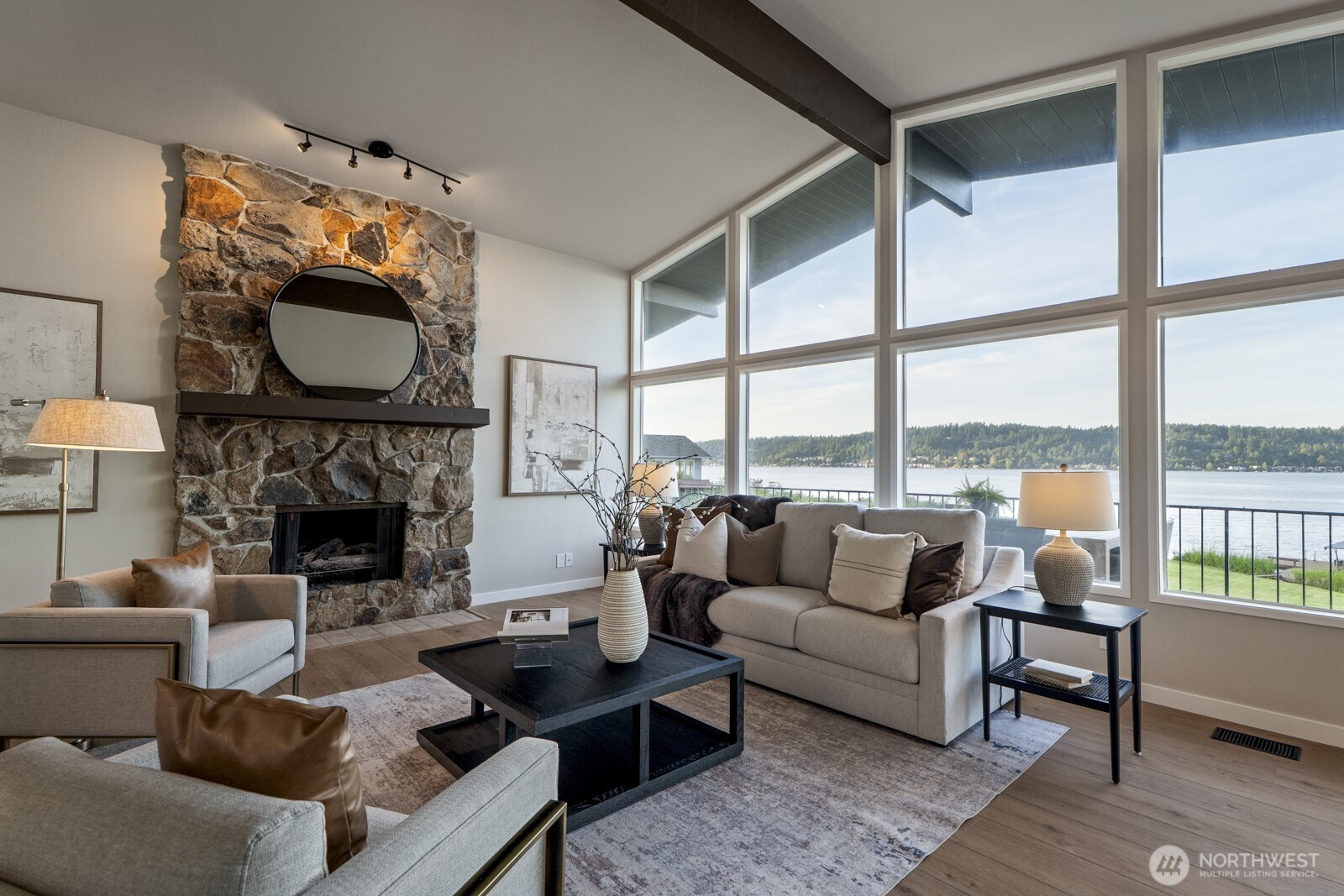 5110 Northwest Sammamish Road Issaquah, WA 98027 - Photo 7 of 40 a living room with furniture a fireplace and floor to ceiling windows