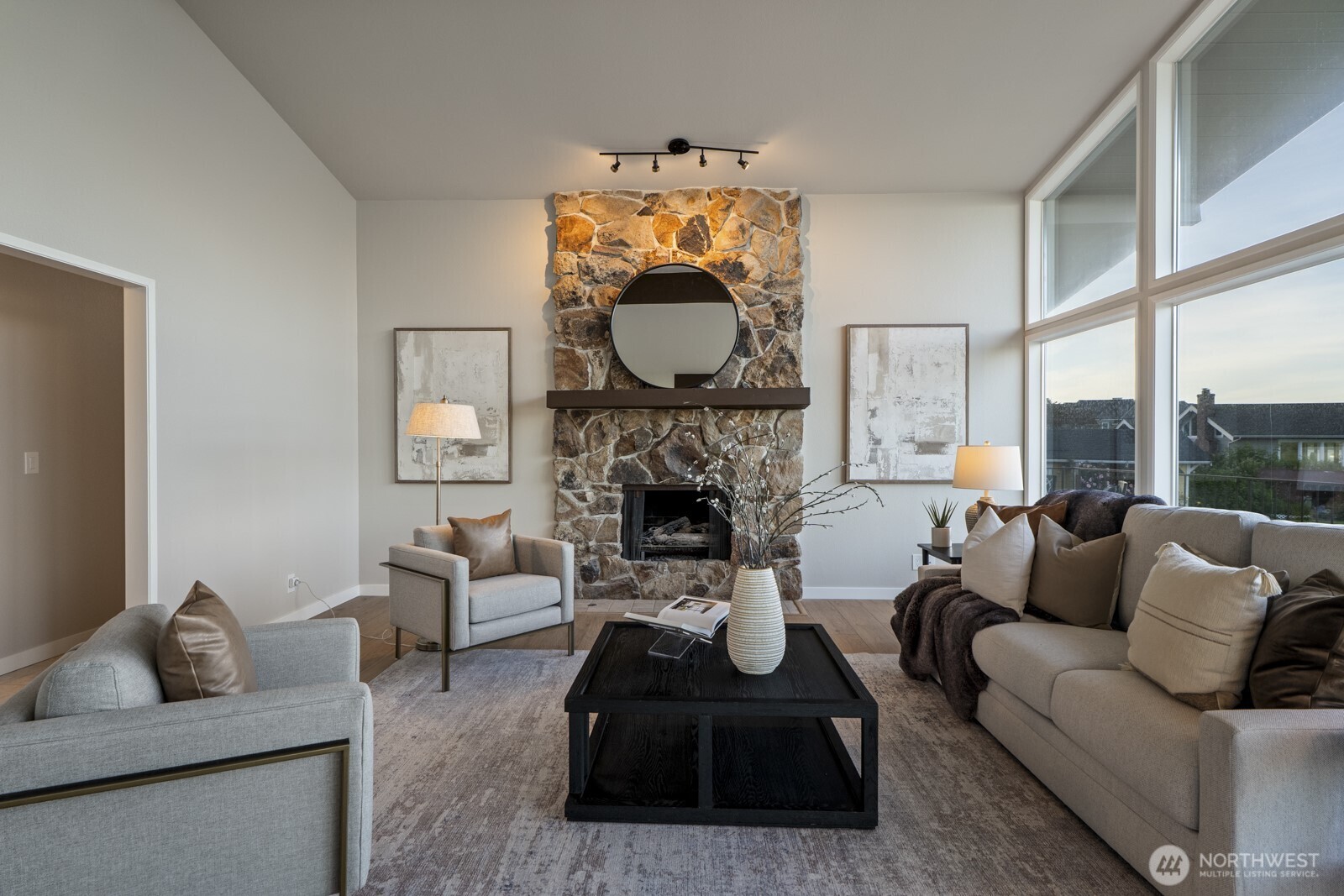 5110 Northwest Sammamish Road Issaquah, WA 98027 - Photo 8 of 40 a living room with furniture a fireplace and a large window