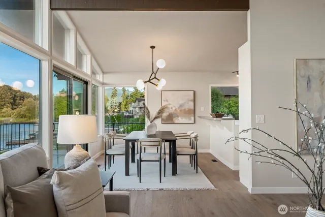 a living room with furniture a window and a table