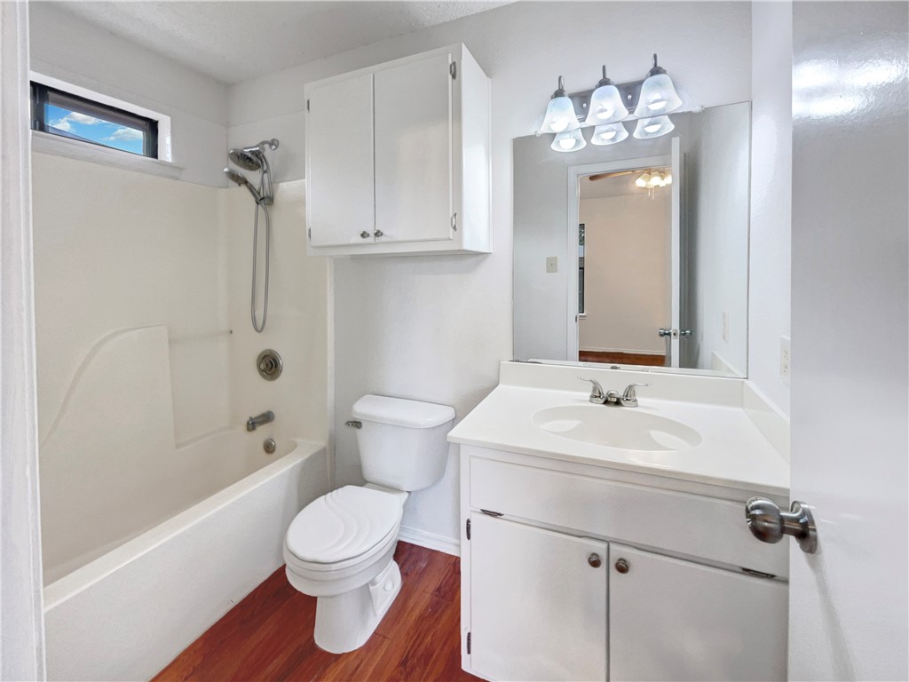 2090 Ridgewood Circle Ingleside, TX 78362 - Photo 11 of 16 a bathroom with a sink a toilet and shower