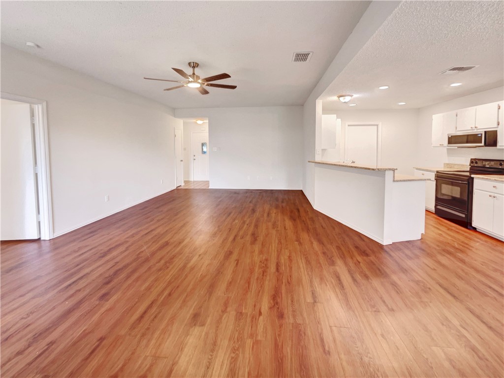 2090 Ridgewood Circle Ingleside, TX 78362 - Photo 13 of 16 a view of a kitchen with wooden floor and a kitchen