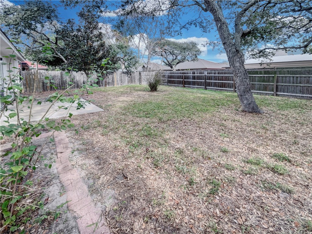 2090 Ridgewood Circle Ingleside, TX 78362 - Photo 15 of 16 a view of a backyard with large trees