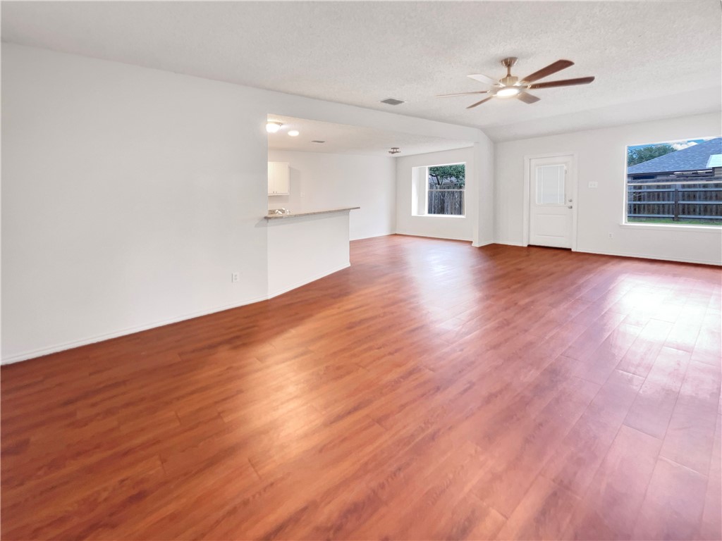 2090 Ridgewood Circle Ingleside, TX 78362 - Photo 3 of 16 a view of empty room with wooden floor and fan