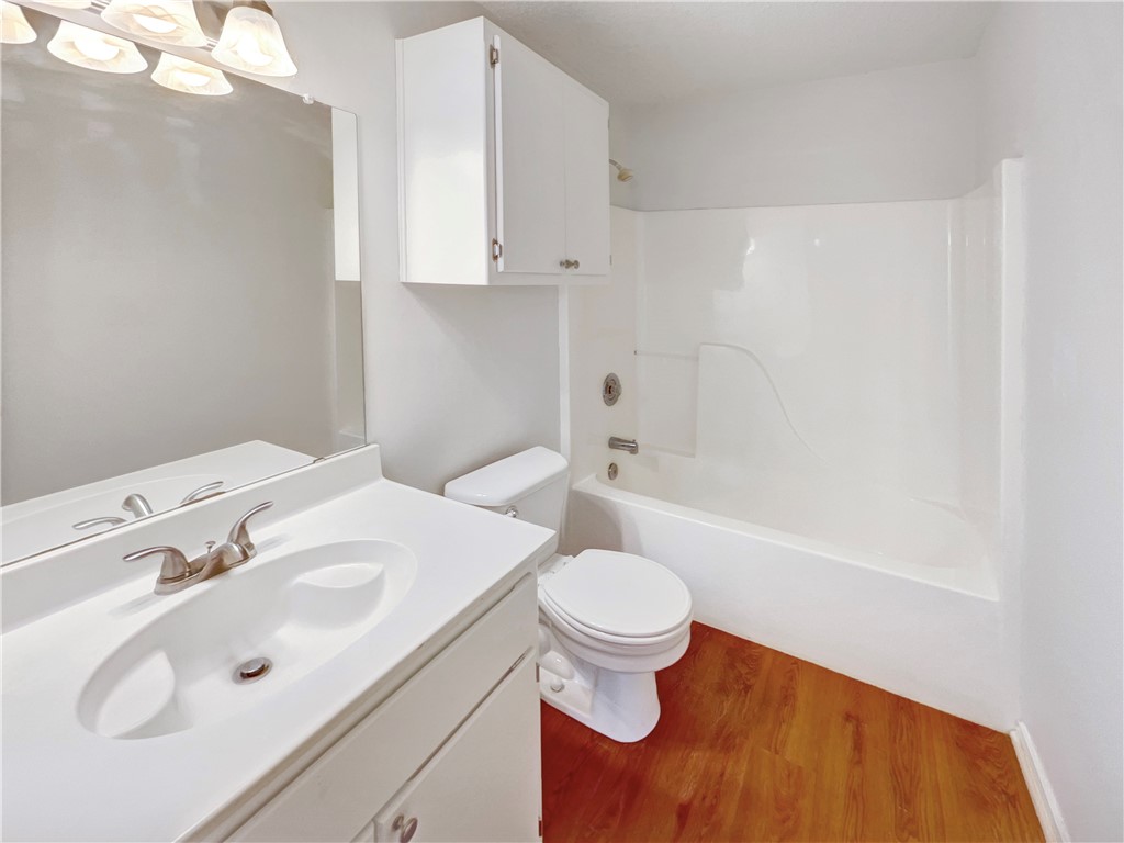 2090 Ridgewood Circle Ingleside, TX 78362 - Photo 7 of 16 a bathroom with a sink toilet and shower