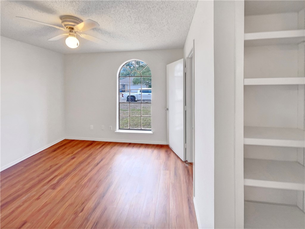 2090 Ridgewood Circle Ingleside, TX 78362 - Photo 9 of 16 a view of room with window and wooden floor