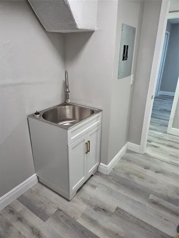 a utility room with sink dryer and washer