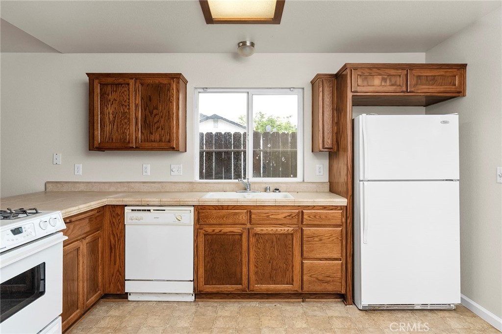1397 Lucy Way Chico, CA 95973 - Photo 14 of 37 a kitchen with a stove and a refrigerator