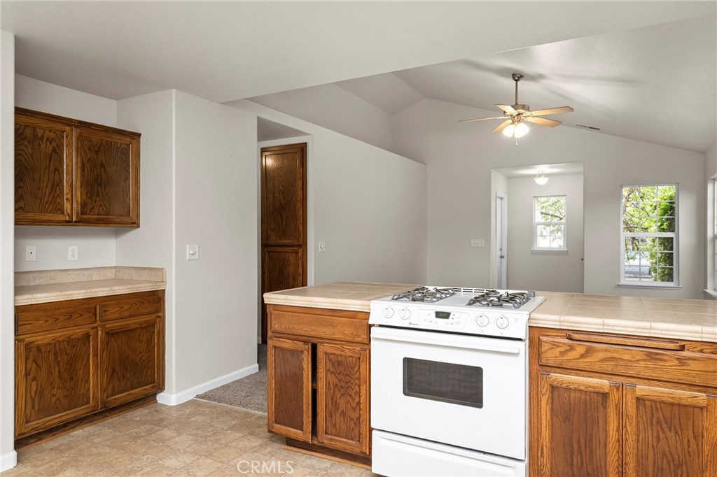 1397 Lucy Way Chico, CA 95973 - Photo 15 of 37 a kitchen that has a sink and a stove in it