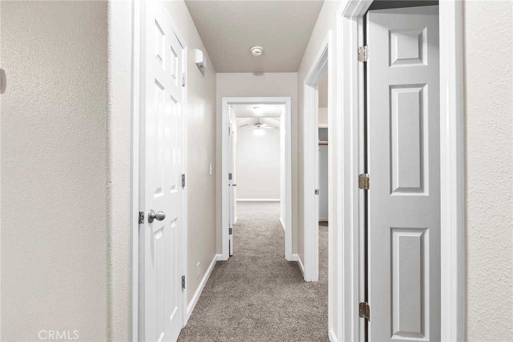 1397 Lucy Way Chico, CA 95973 - Photo 20 of 37 a view of a hallway with wooden floor and closet area