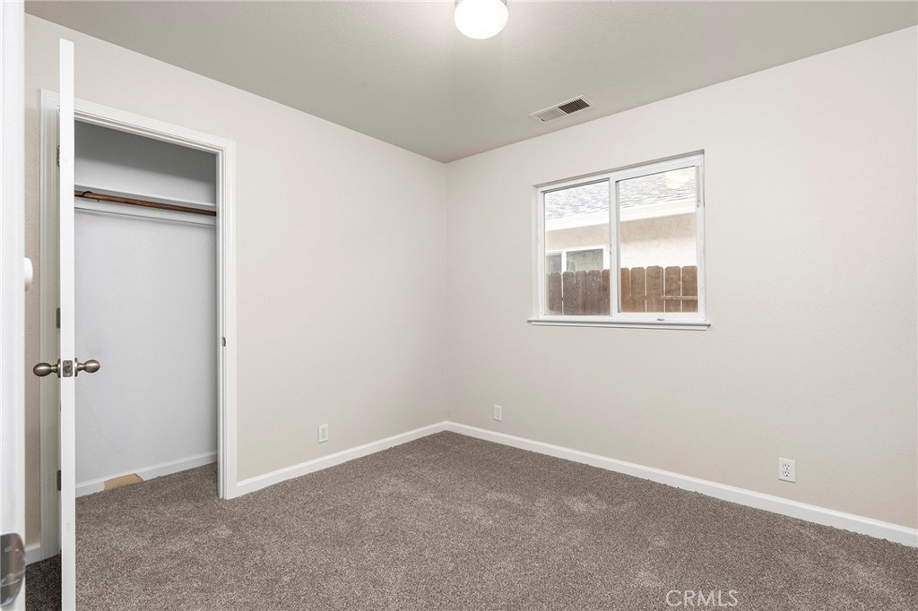 1397 Lucy Way Chico, CA 95973 - Photo 21 of 37 a view of an empty room with a window